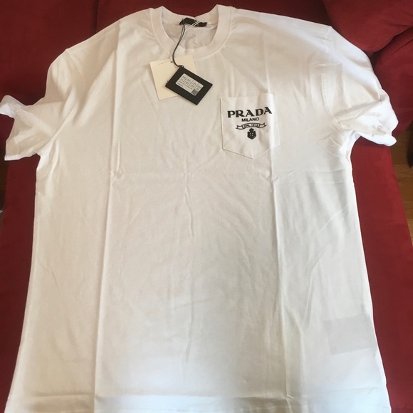 Prada white tee-shirt with print on pocket. Size 2XL. New. Authentic. Never worn